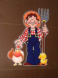 Farmer with hen and duck